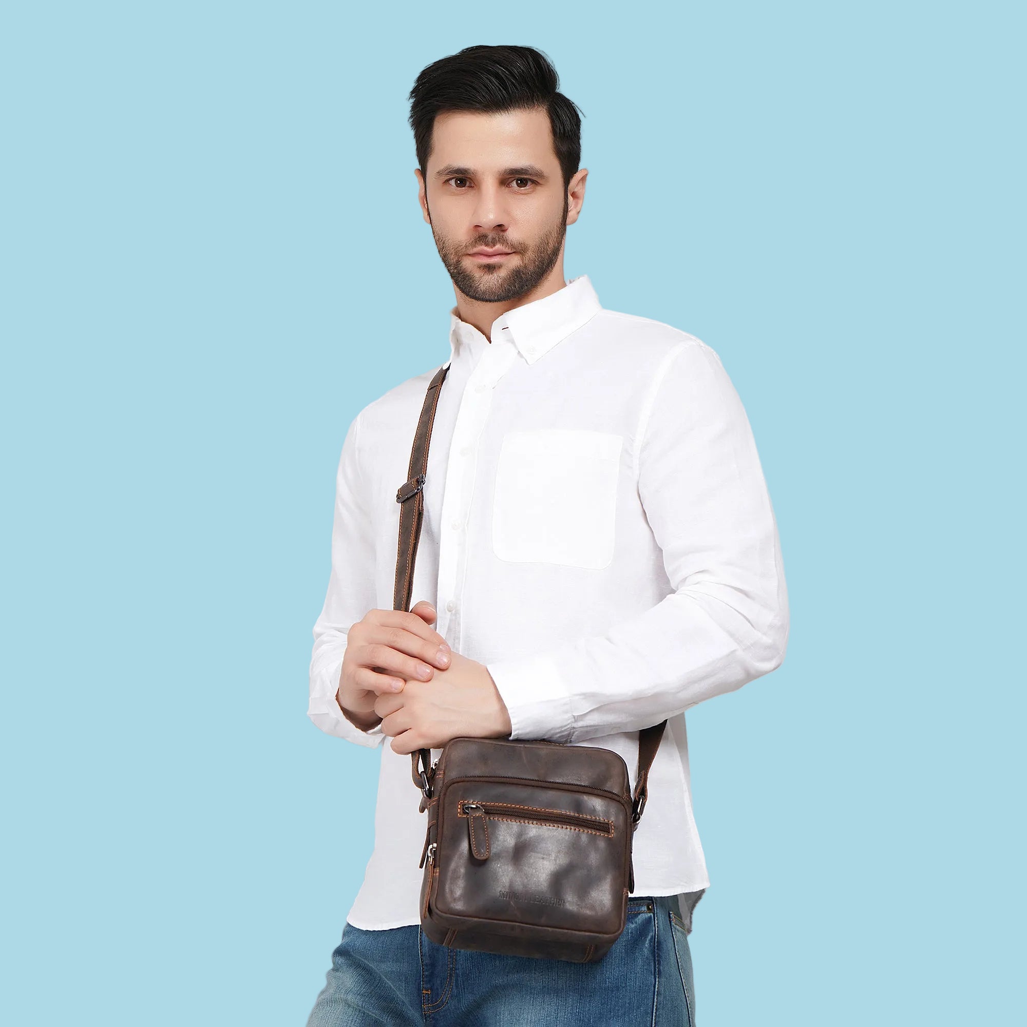 Minori Leather Cove brown leather crossbody bag with adjustable strap and minimalist design.