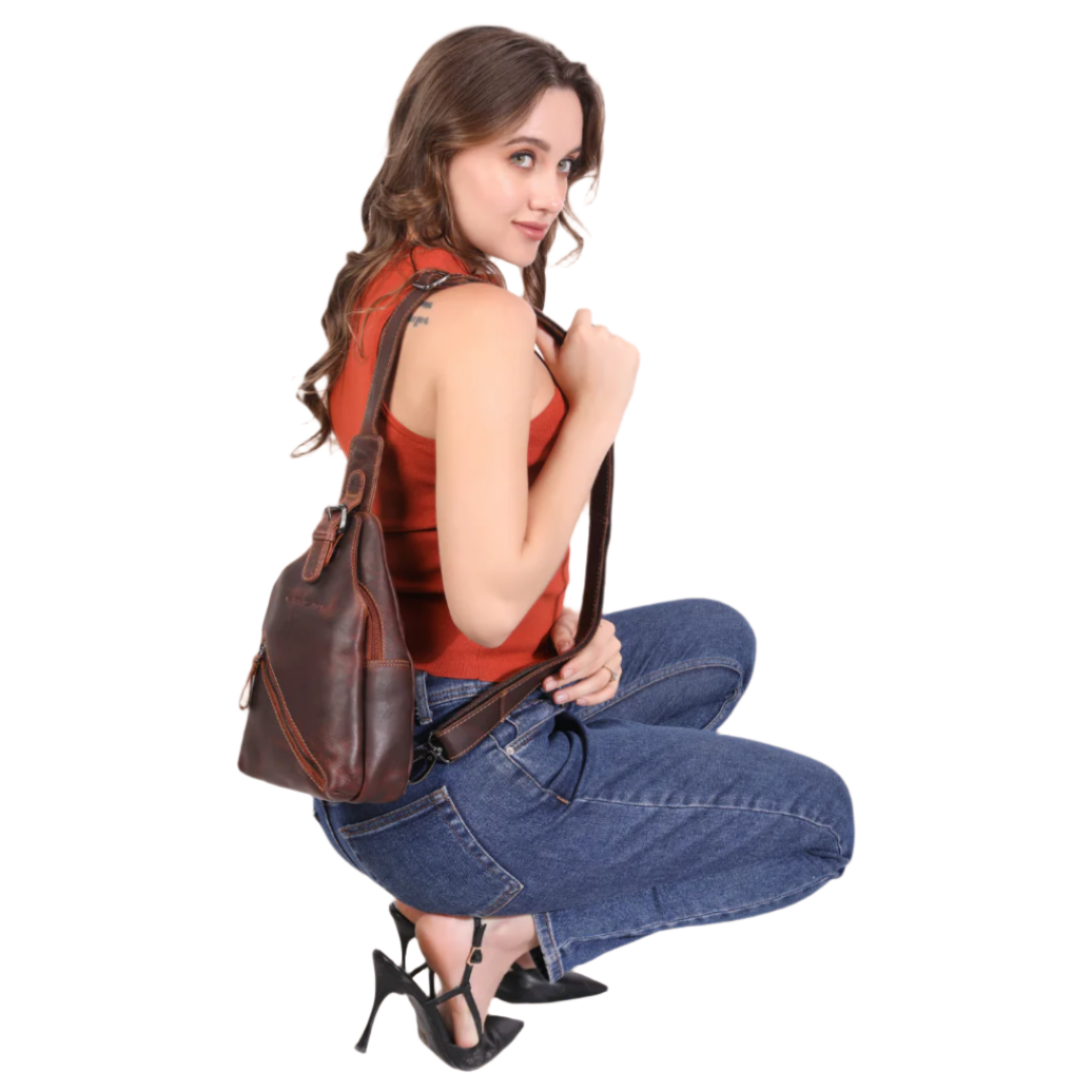 Woman holding a brown Minori leather handbag on a white background