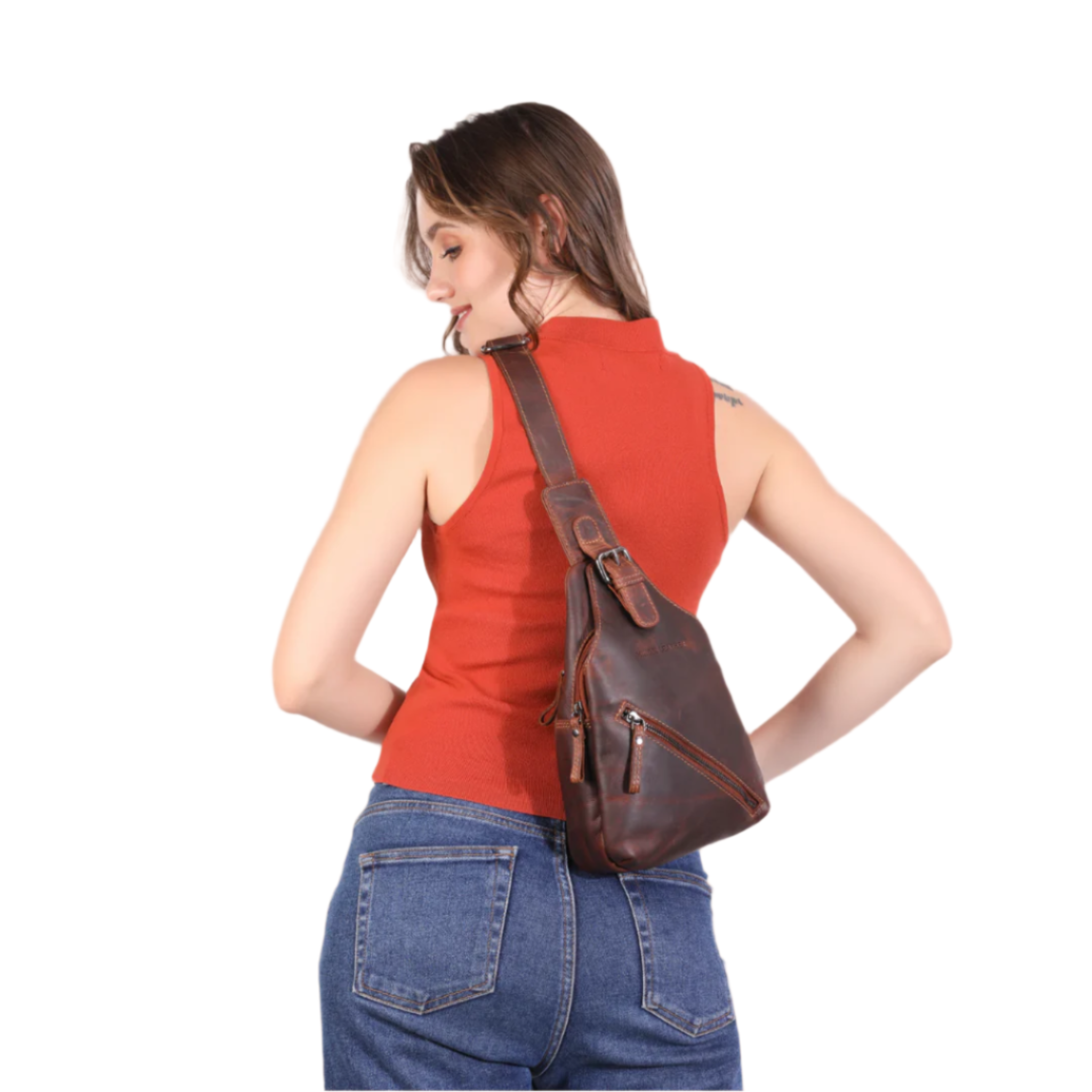 Woman wearing a brown Minori leather sling bag on a white background