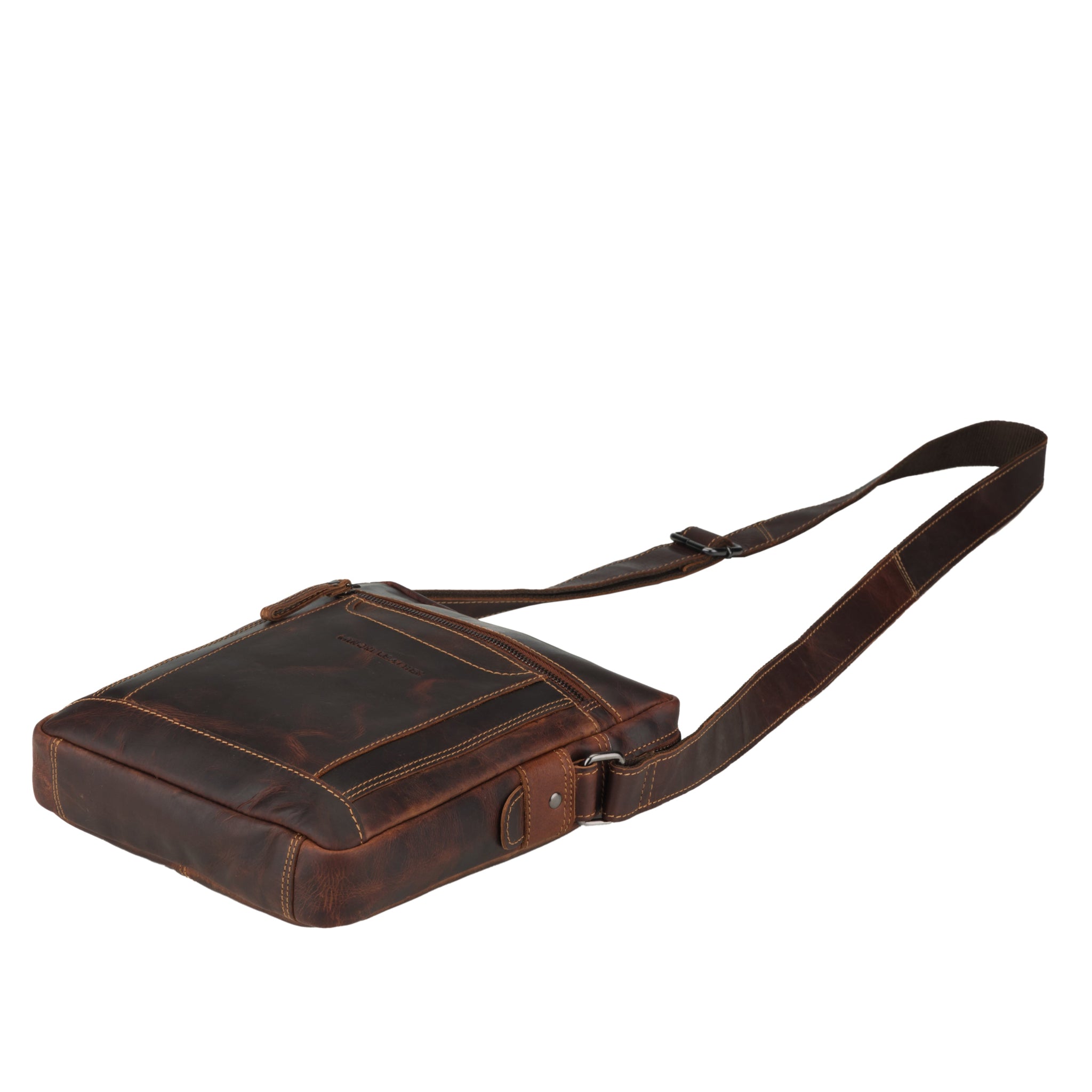 Flat lay view of Brown Minori leather crossbody bag on a white background