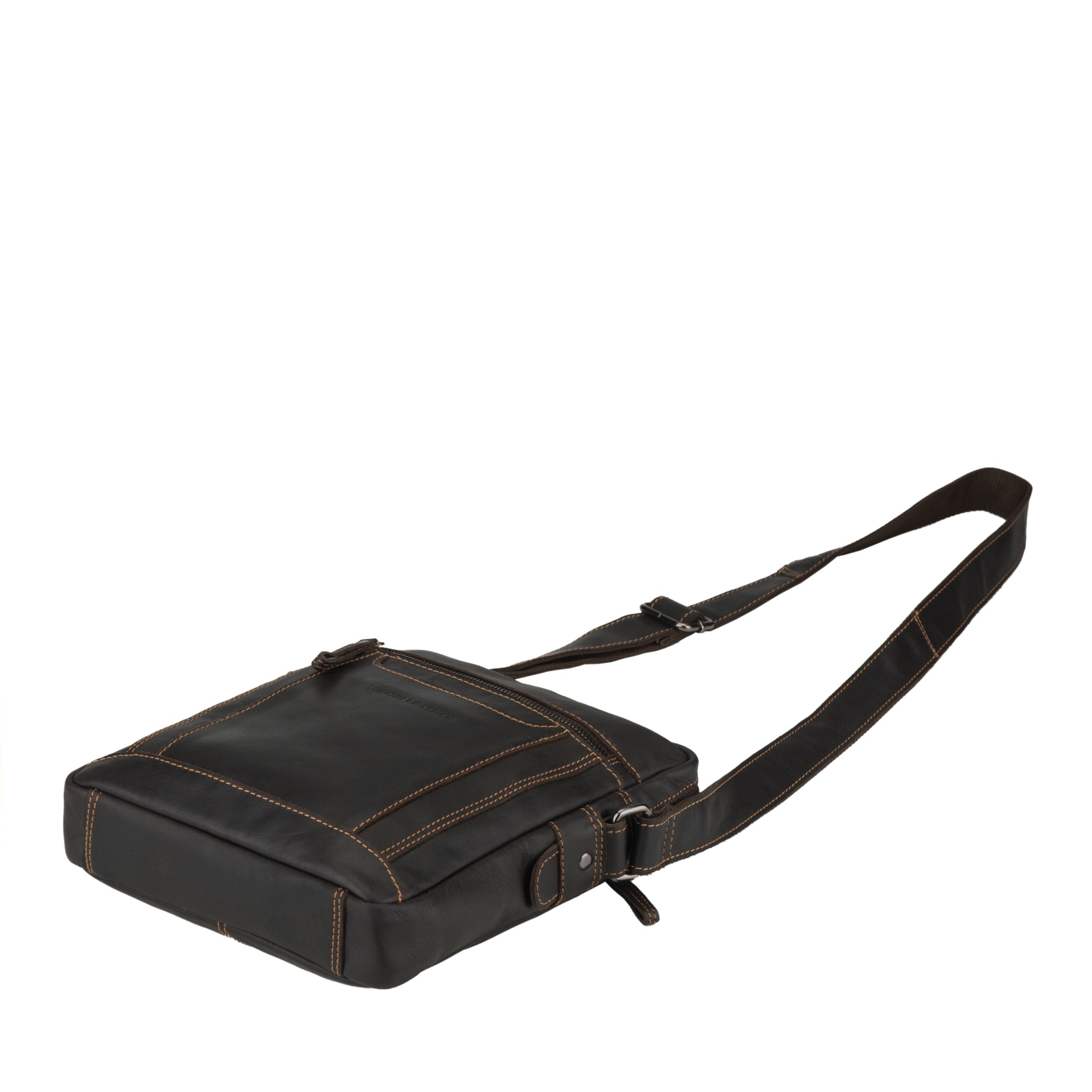 Falt lay view of brown Minori leather bag with a strap on a white background