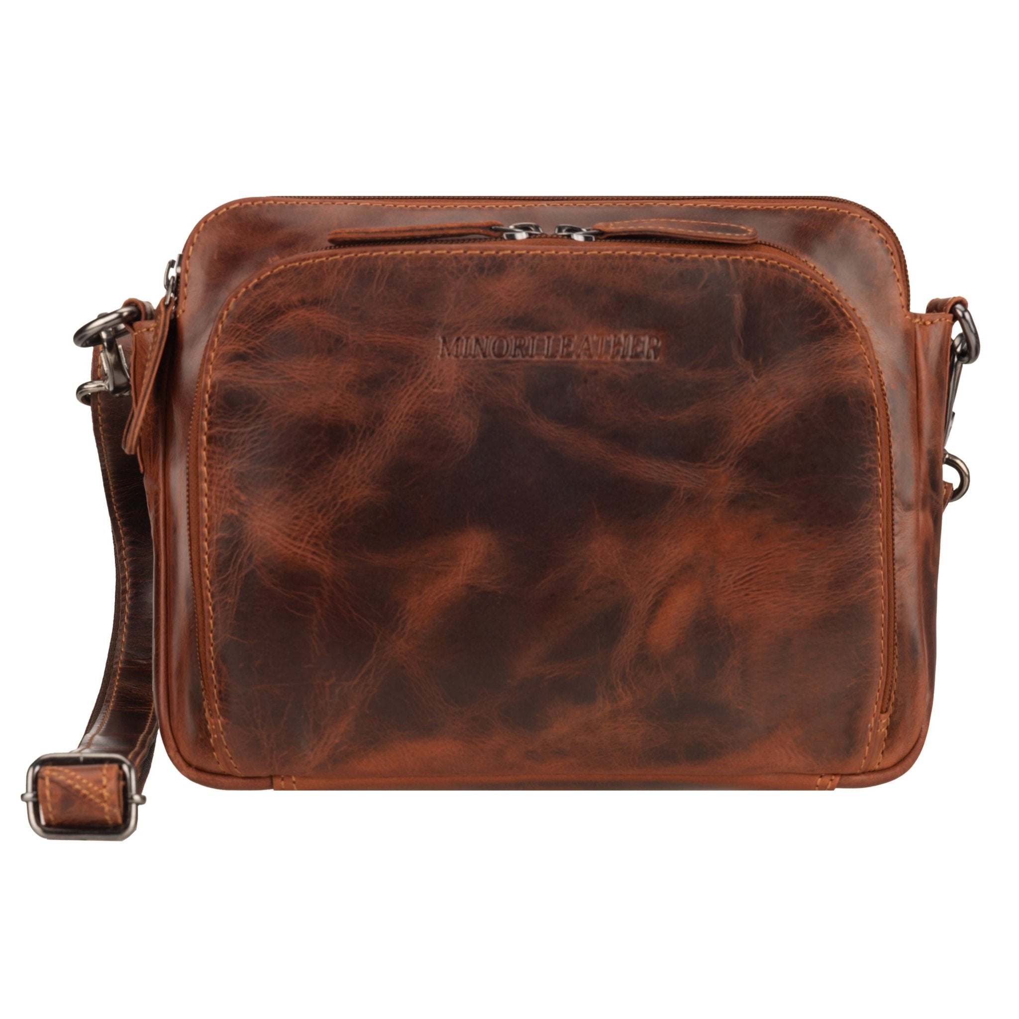 Minori Leather Ellis unisex chestnut leather crossbody bag with adjustable strap and sleek design.