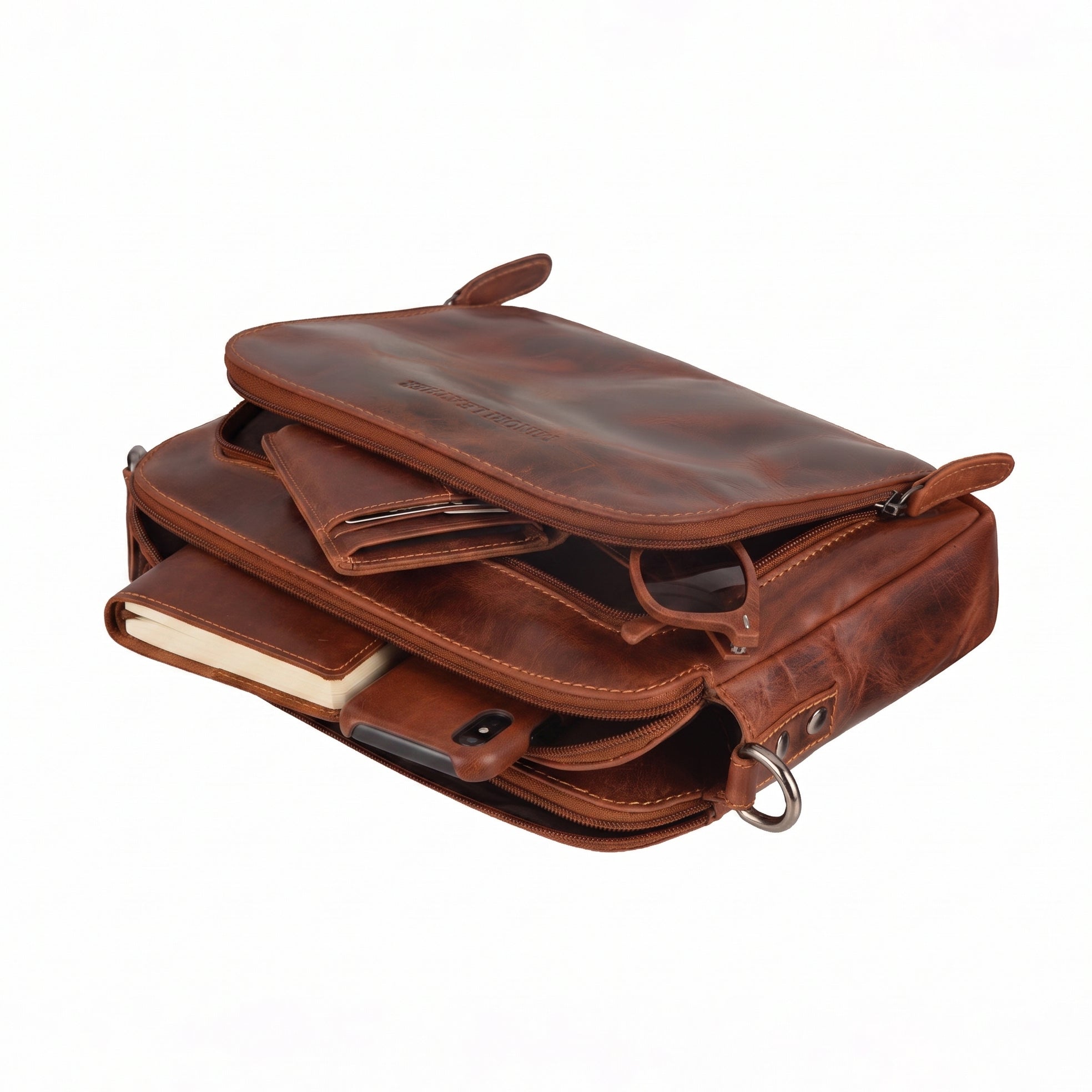 Minori Leather Ellis unisex chestnut leather crossbody bag with adjustable strap and minimalist design.