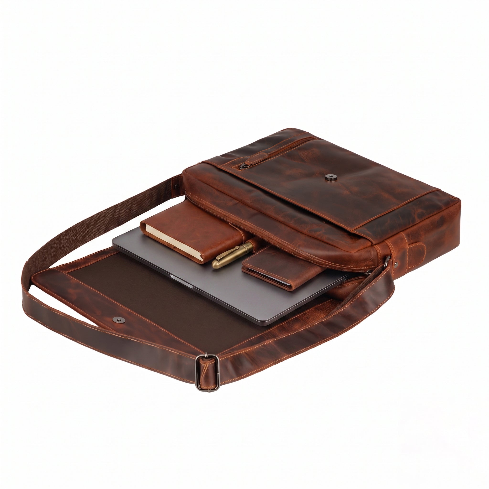 Minori Leather Jordan leather messenger bag in chestnut with adjustable shoulder strap and spacious interior for laptop storage.