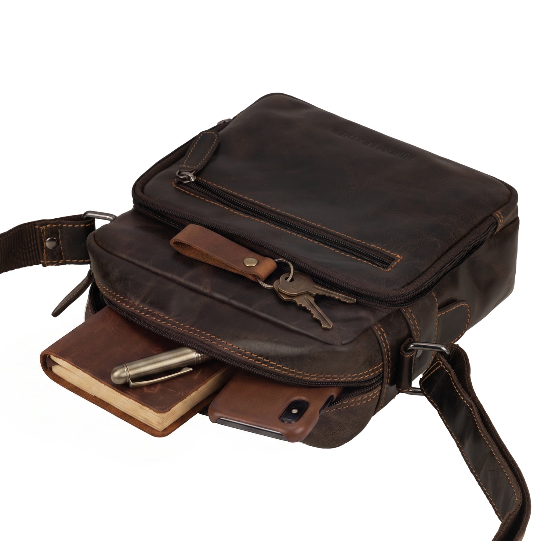 Minori Leather Harbor brown leather crossbody messenger bag with adjustable strap and sleek design.