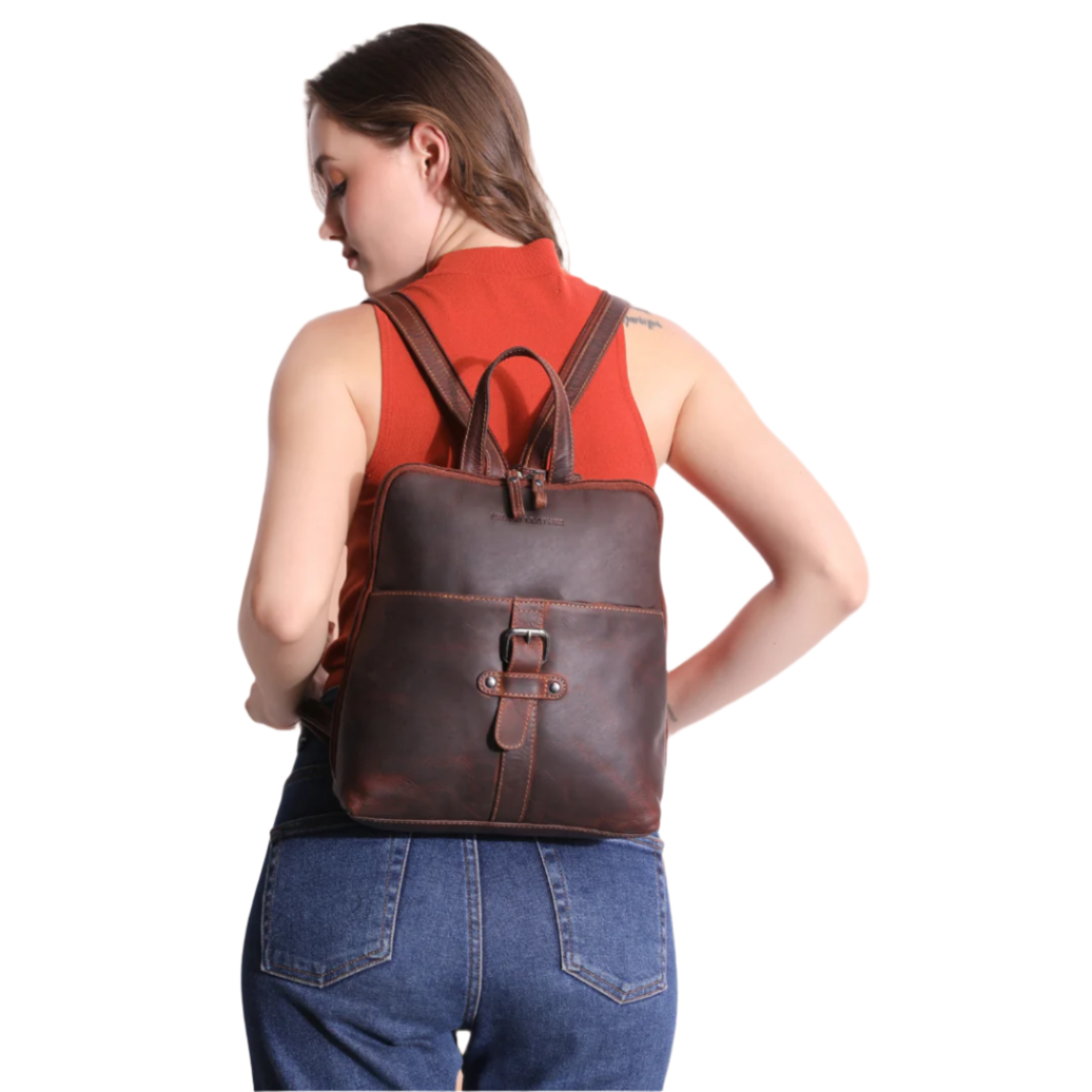 Rear view of model wearing a chestnut brown Minori leather backpack with both straps on.