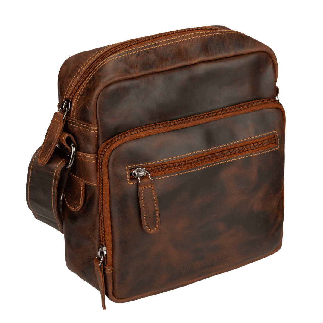 Minori Leather Harbor Chestnut leather crossbody bag with adjustable strap and sleek design, suitable for everyday use.