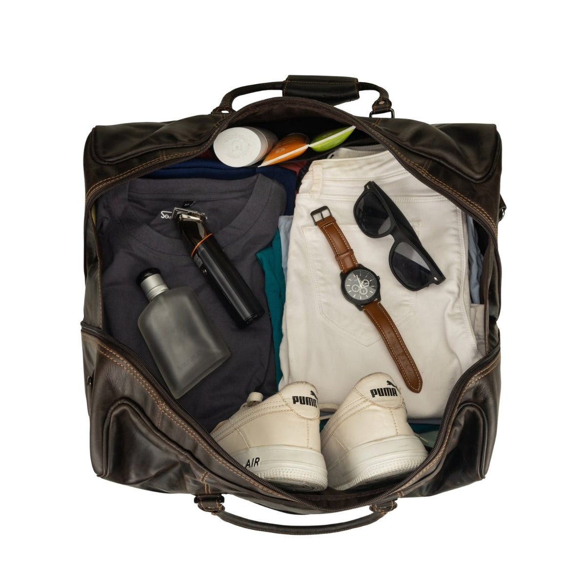 Brown Riley leather duffle bag by Minori Leather with sturdy handles and spacious interior, perfect for travel and weekend trips.