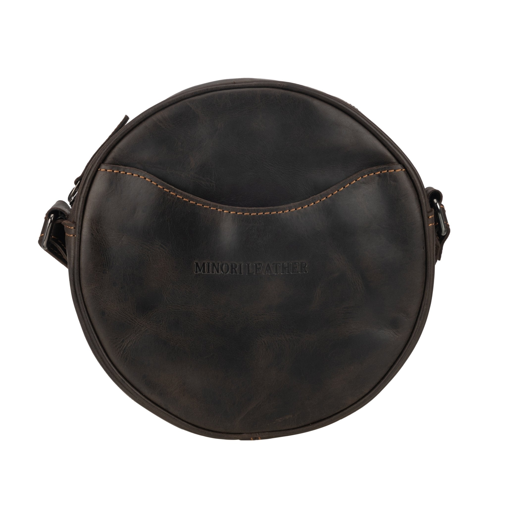 Minori Leather Luna leather round crossbody bag in chestnut, brown, and hair-on brown with adjustable strap and textured finish.