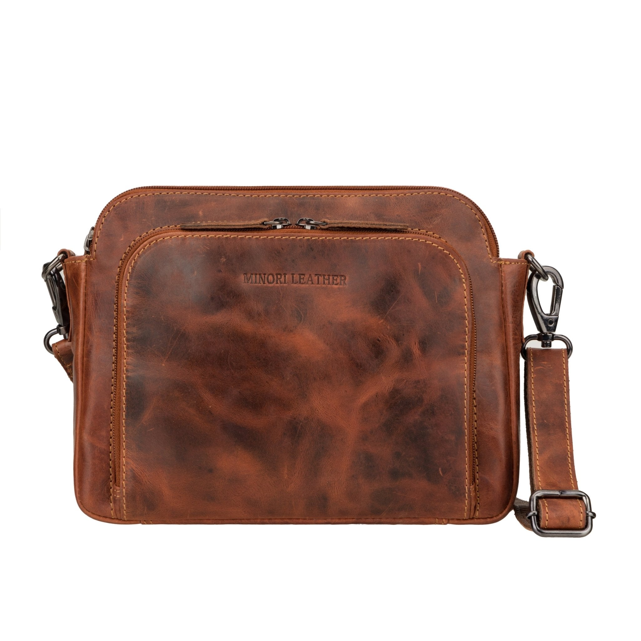 Minori Leather Ellis leather crossbody bag in chestnut color with adjustable strap and sleek design.
