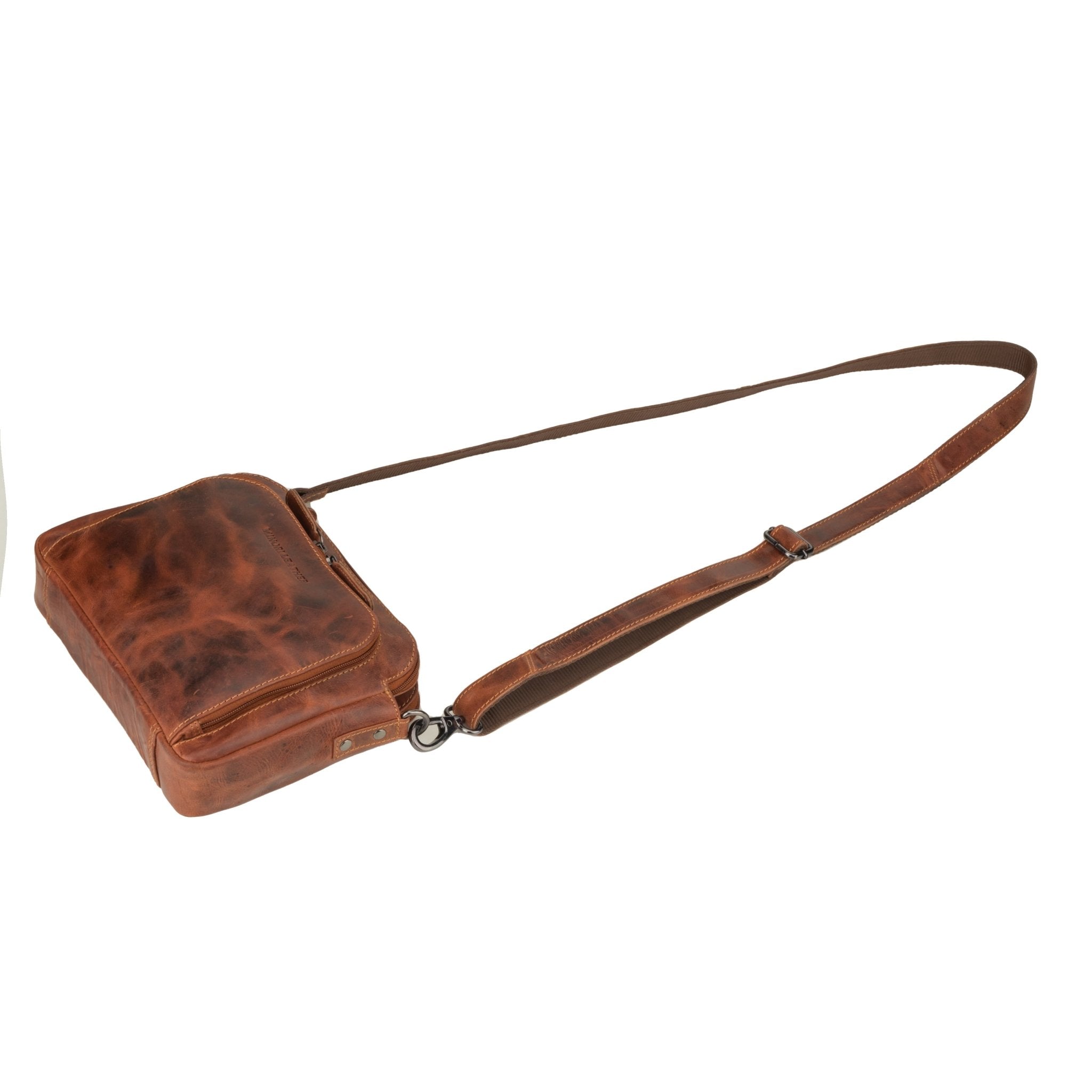 Minori Leather Ellis leather crossbody bag in chestnut, featuring a sleek design and adjustable strap for versatile carrying.