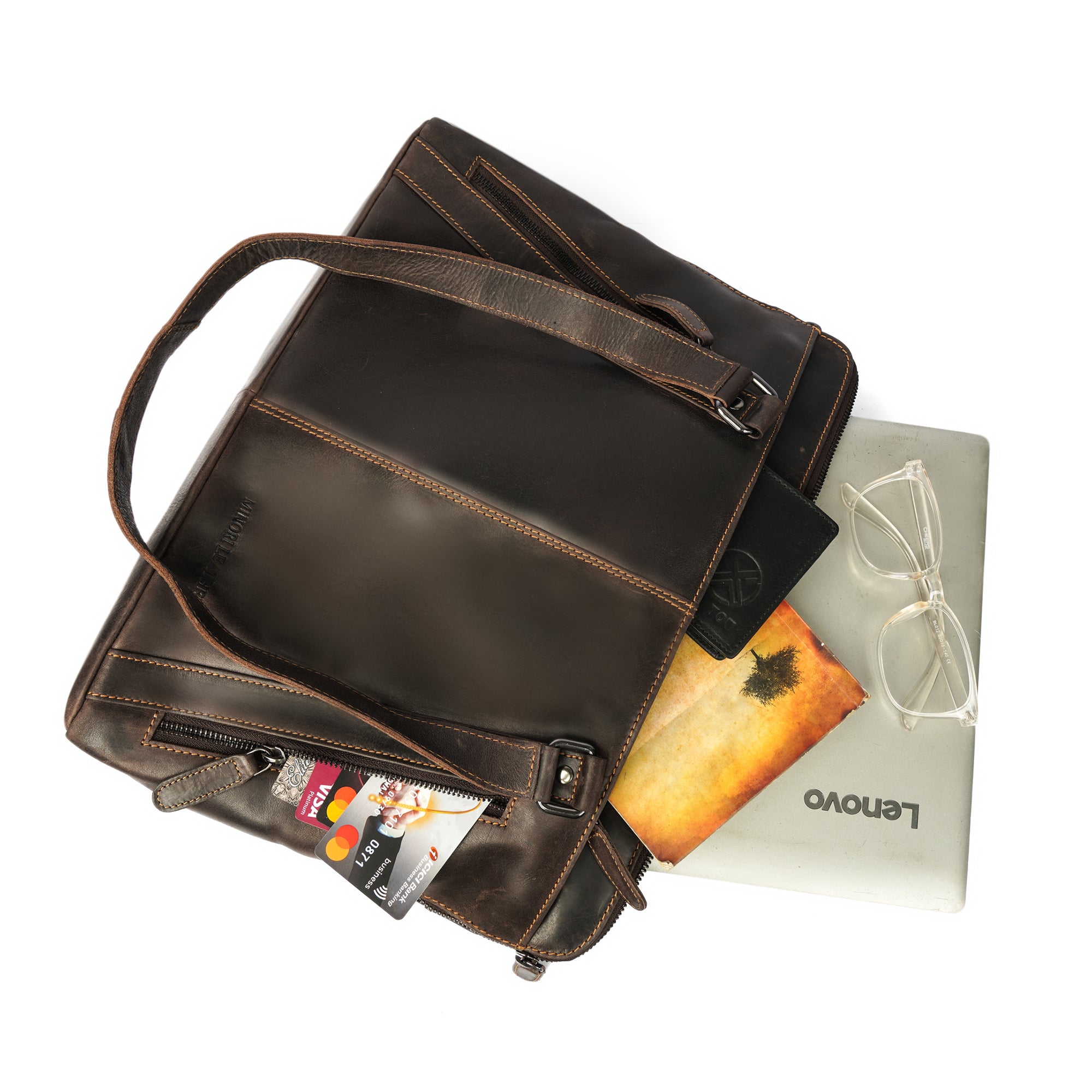 Minori Leather Camille leather laptop tote bag with sturdy handles and sleek design, perfect for carrying laptops and essentials.